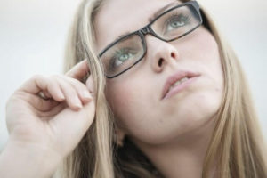closeup of woman with rectangular eyeglasses